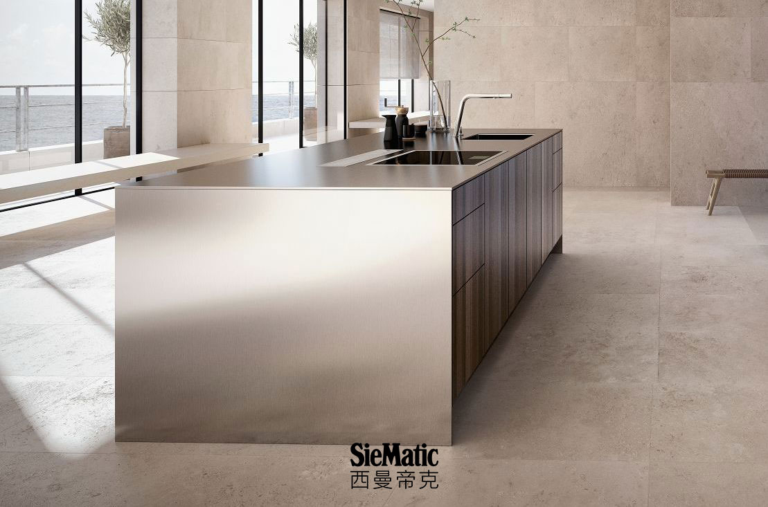 SieMatic Pure SE kitchen island in smoked oak veneer with countertop and side panels that appear 1 cm thick in stainless steel