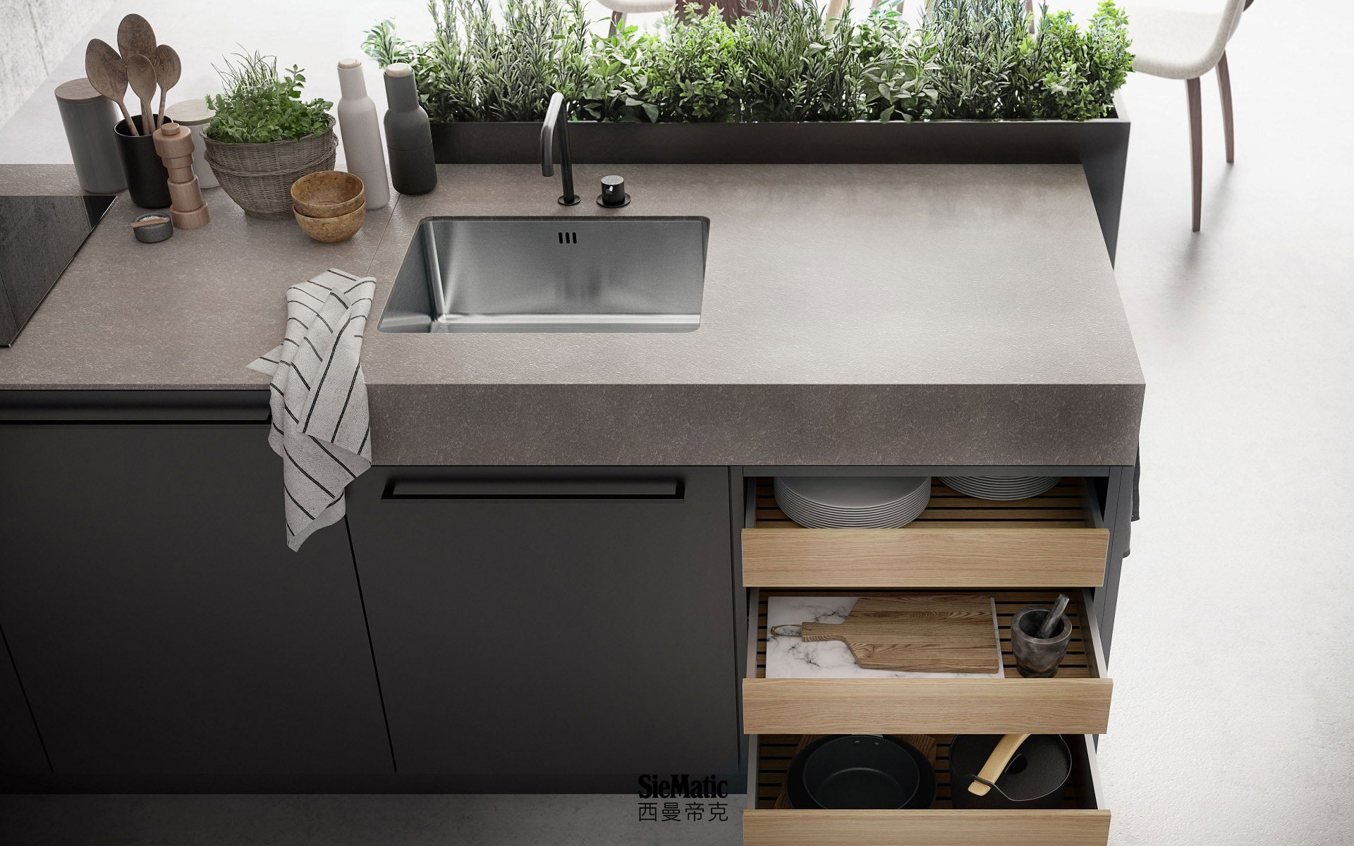 Kitchen island with SieMatic StoneDesign countertop and herb garden from the Urban style collection