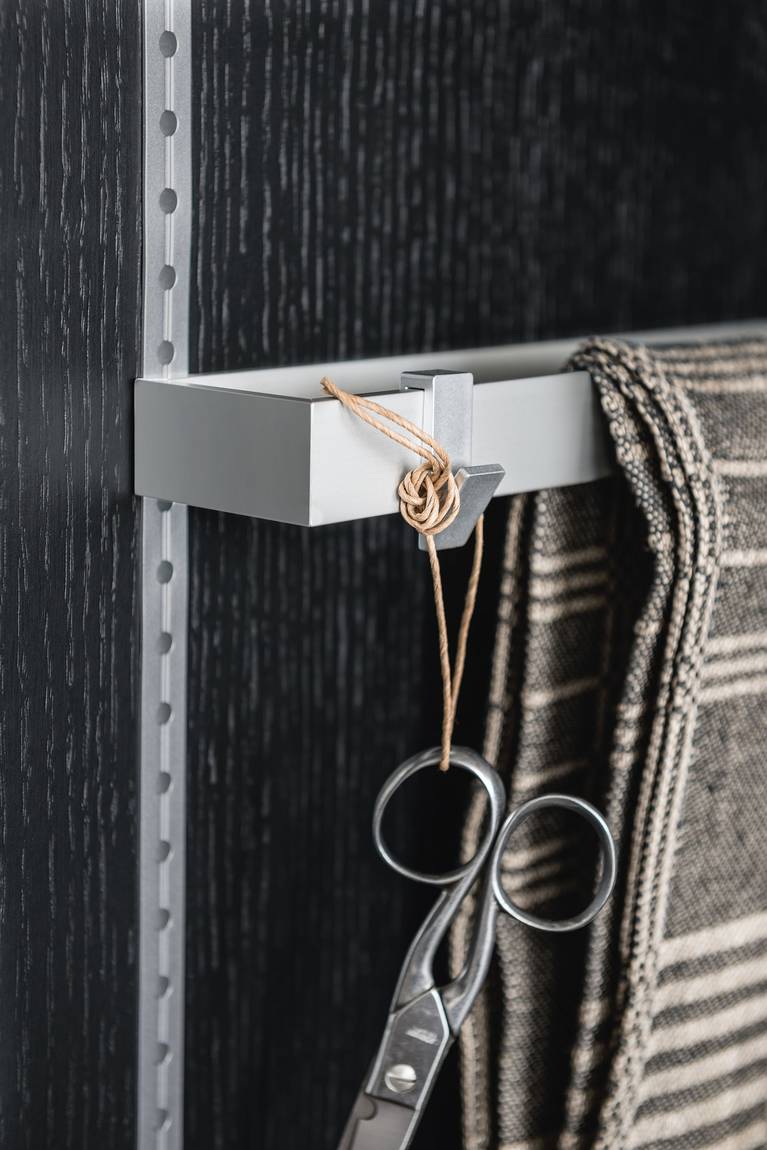 Dishcloth rack and hooks from the SieMatic MultiMatic interior organization system for kitchen cabinet doors