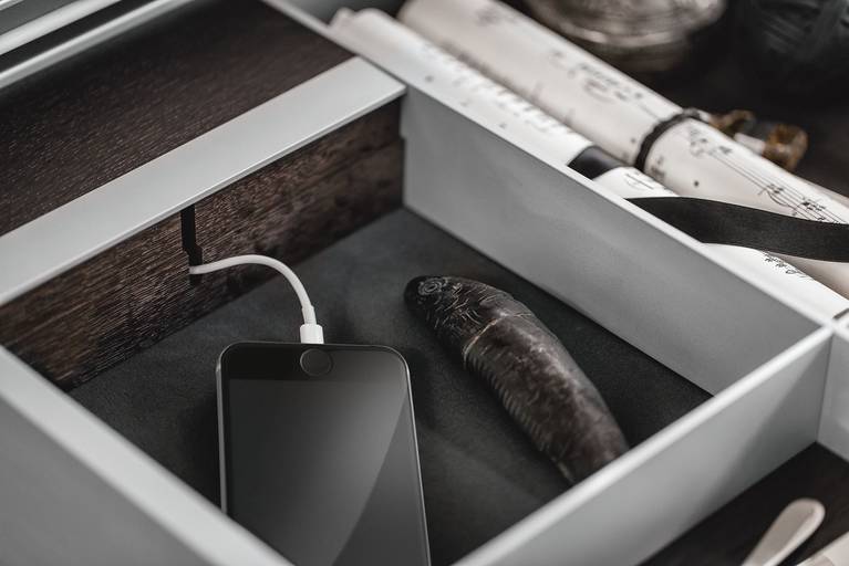 iPhone in integrated USB charging station in kitchen drawer by SieMatic