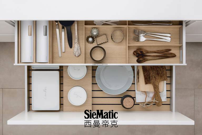 Versatile combination of SieMatic kitchen accessories in light oak wood