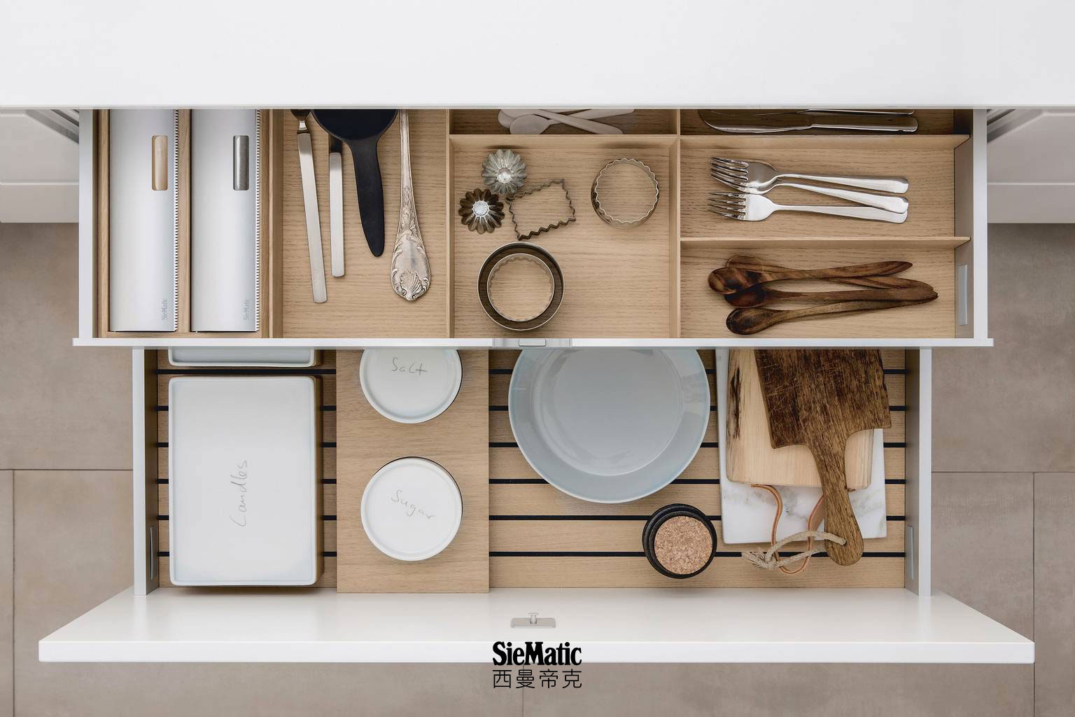 Versatile combination of SieMatic kitchen accessories in light oak wood