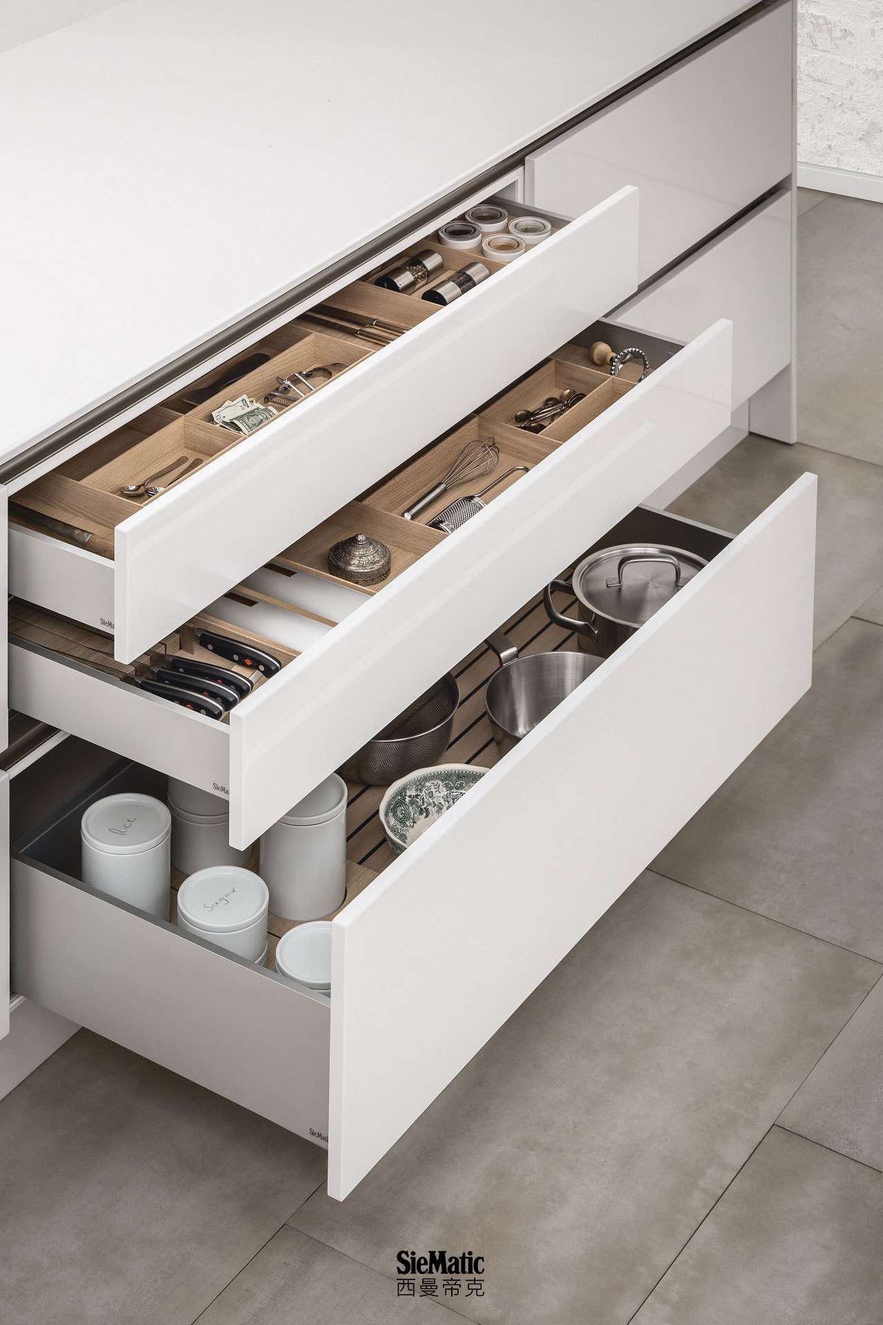 SieMatic kitchen interior accessories for drawers and pull-outs offer versatile organization options.