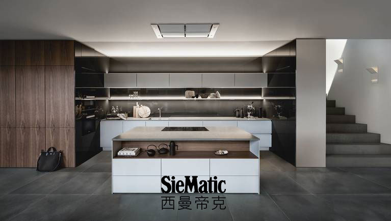 SieMatic Pure S2 SE with kitchen area in grey as well as cabinets in exclusive walnut veneer