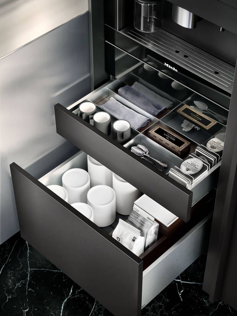 Porcelain containers and cutlery inserts from the SieMatic Aluminum Interior Accessories System for kitchen drawers