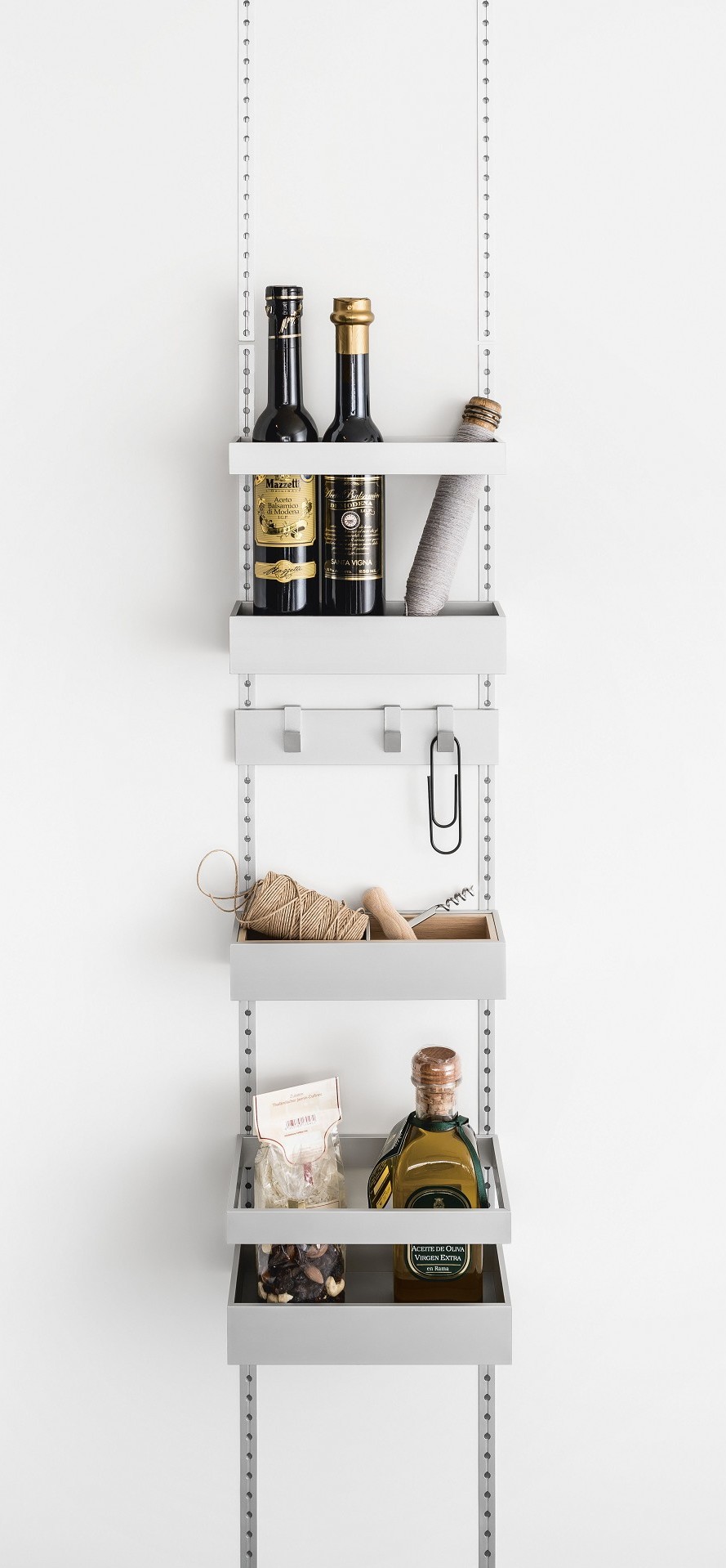 Storage trays and hook railing in the SieMatic MultiMatic interior organization system for jars, boxes and small items - even for narrow cabinet doors