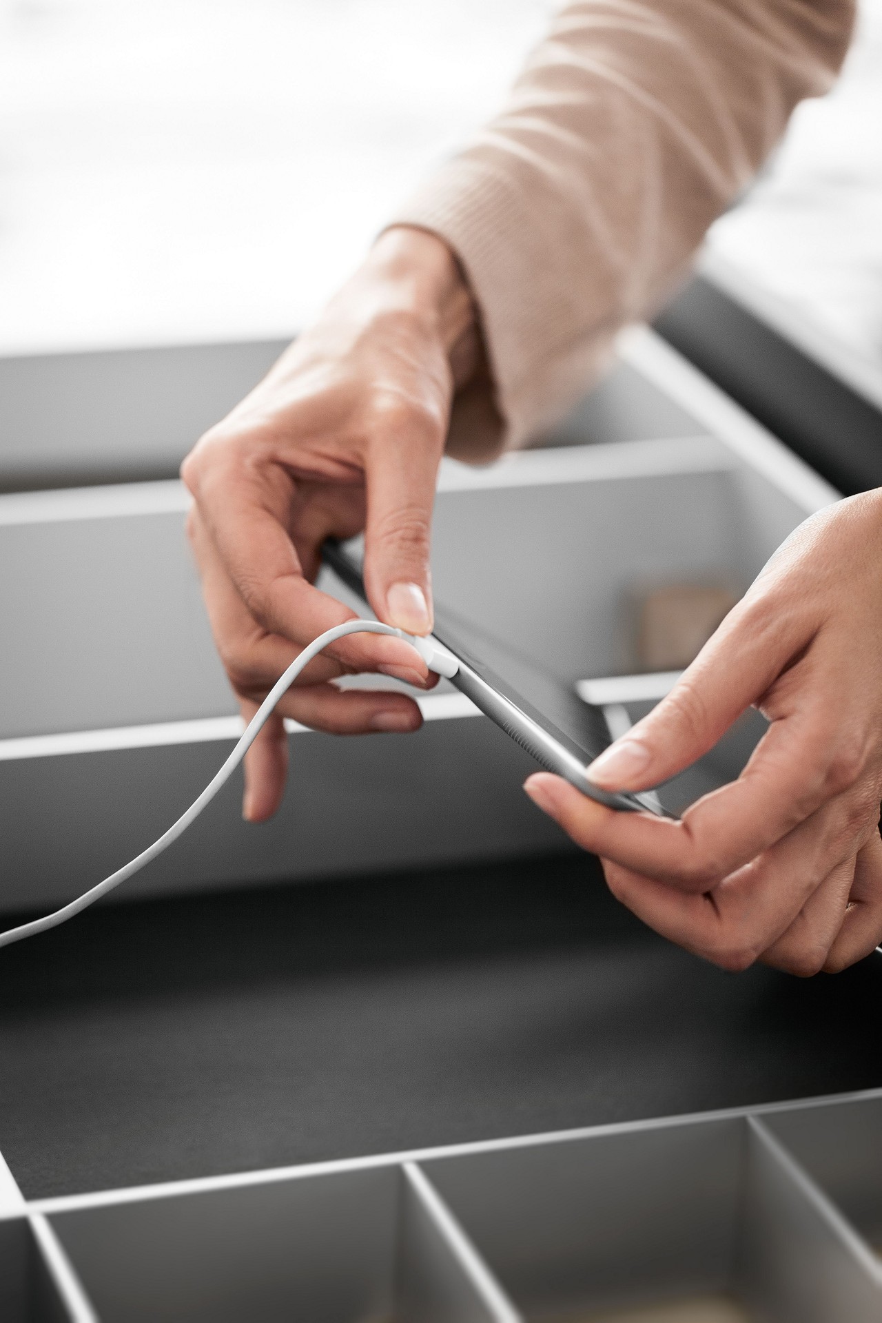 USB charging station in drawers and pull-outs for loading up iPads and iPhones in the kitchen